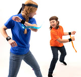 Two people playing Ribbon Ninja Game with ribbons on a white background
