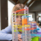 Child playing with a Trestle Tracks Deluxe Set  indoors