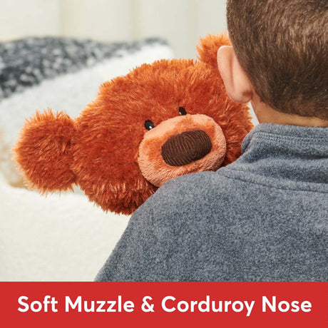 Child holding a Pumpkin Pie Toothpick Bear, 15 In with a soft muzzle and corduroy nose, on a light background.