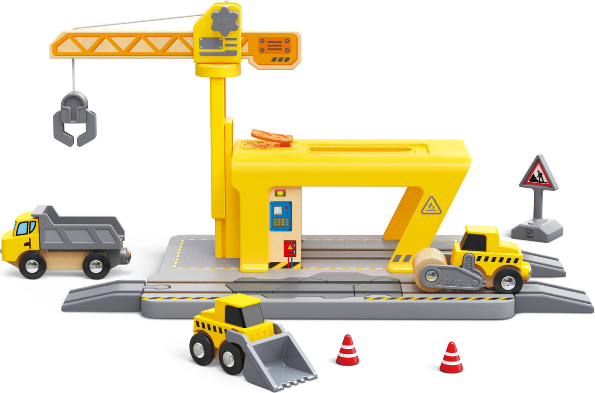 Toy Railway Crane Construction set with crane, dump truck, and bulldozer on a white background