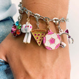 Multicolored charm bracelet on a wrist with various charms.