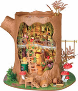 Fairytale Tree House DIY Miniature House with a forest theme, including trees, plants, and furniture.
