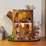 Fairytale Tree House DIY Miniature House model with miniature furniture and decorations on a wooden surface.