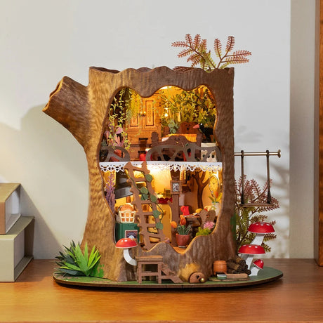 Fairytale Tree House DIY Miniature House model with miniature furniture and decorations on a wooden surface.