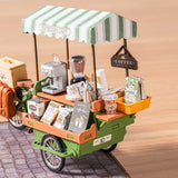 Aromatic Coffee Cart DIY Miniature House with coffee-making equipment and supplies on a wooden background