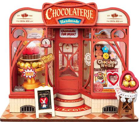 Sweet Chocolate Shop, Super Mini Houses with red and white facade, featuring various chocolate items and signs.