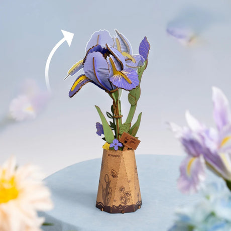 Purple Iris DIY Wooden Flower 3D Puzzle of an iris plant with a cardboard vase on a light blue background.