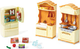 Toy Calico Critters kitchen play set  with refrigerator, sink, and stove on a white background