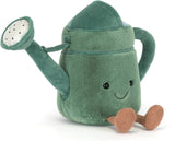 Soft plush watering can toy in shades of green with a smiling face and brown feet, designed as the Amuseables Watering Can for children's imaginative play.