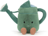 Soft green plush toy designed like a watering can with a smiling face and small brown feet, named Amuseables Watering Can, perfect for imaginative play.