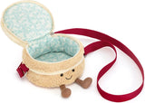 A plush Amuseables Birthday Cake Bag  featuring a cream-colored textured exterior, a light blue patterned interior lining, a red strap, and small wooden legs.