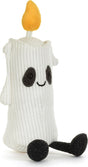 A white Amuseables Flickerty Candle toy with a yellow flame on top, black embroidered eyes and mouth, and black feet, shown on a plain white background.