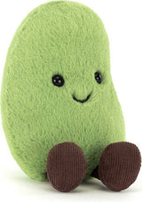 A green plush Amuseables Soyella Edamame Bean toy with a smiling face and brown fabric feet, photographed on a plain white background.