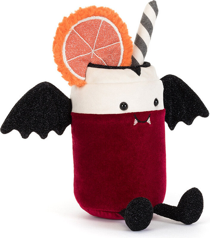 A plush Amuseables Vampop Drink toy on a white background. The character features a deep red body, a white head, black bat wings, a black-and-white striped straw, and a glittery orange grapefruit garnish.