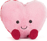 Amuseables Colette Pink Heart Macaron plush toy with a smiling face on a white background