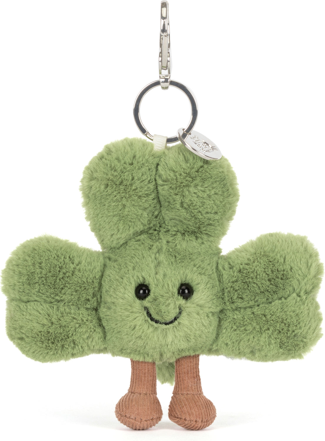 Amuseables Siofra Shamrock Bag Charm featuring a soft green plush shamrock with black eyes, a smiling face, and small brown legs, attached to a silver keyring clip.