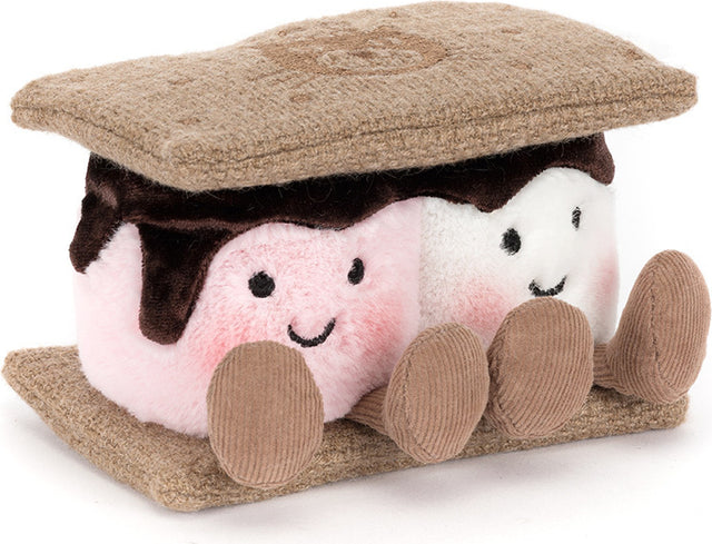 A plush Amuseables S'mores toy featuring two smiling marshmallows, one pink and one white, with dark brown chocolate drizzle, set between tan graham cracker-like top and bottom layers.