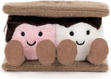 A plush Amuseables S'mores shaped like a sandwich, with a brown textured top and bottom layer, a dark brown middle layer, a pink plush face on the left, a white plush face on the right, and three brown corduroy feet in front.