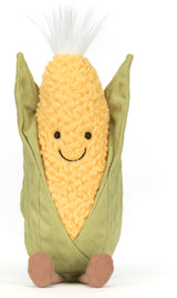 Amuseables Sweetcorn plush toy with a cheerful smiling face, soft yellow textured body, green fabric husk, and small brown feet, designed as a cute children's toy.