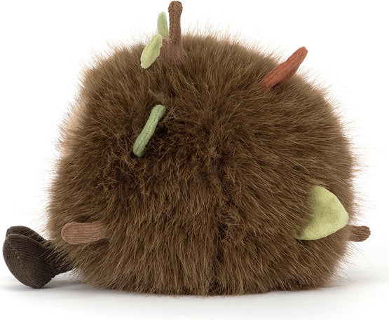 A brown fuzzy Amuseables Mulshi Woodland Floor plush toy with small leaf and stem accents in green, brown, and orange, photographed on a clean white background.