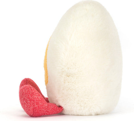 Soft plush shaped like a white boiled egg with a red heart-shaped accessory beside it, designed as the Amuseables Heart Boiled Egg plush toy.