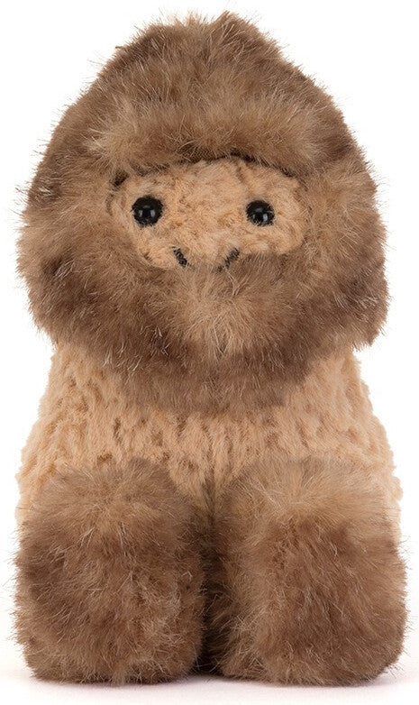A plush  toy with a fluffy brown fur, tan face and body, and small black eyes, photographed against a plain white background.