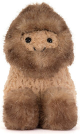 A plush  toy with a fluffy brown fur, tan face and body, and small black eyes, photographed against a plain white background.