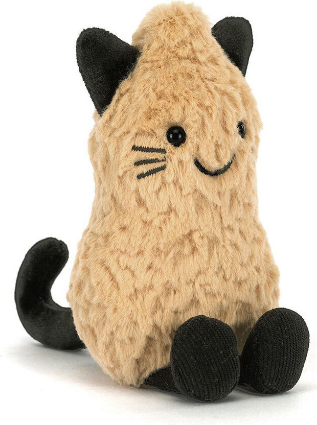 A plush Amuseables Peanut Cat Outfit toy in a warm beige/tan color with black ears, tail, paws, and feet, featuring embroidered black eyes, whiskers, and a smile on a white background.