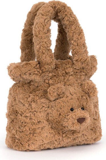 A plush Bartholomew Bear Handbag in a warm medium brown color, featuring a shaggy faux fur texture, double top handles, and a small embroidered face on the front.