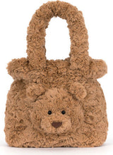 A brown Bartholomew Bear Handbag made of curly, textured faux fur, featuring a small embroidered face and a top handle, shown against a plain white background.