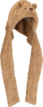 A plush Bartholomew Bear Bundlesnug hooded scarf in a warm tan-brown color, featuring embroidered bear eyes and nose on the hood and long hanging ear flaps, shown against a plain white background.
