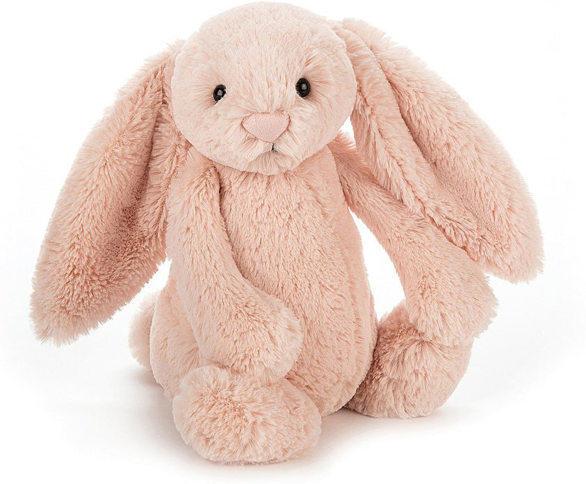 Bashful Blush Bunny Medium is a soft, plush stuffed animal with long floppy ears, a gentle expression, and a cuddly pastel pink color, perfect as a toddler toy or gift.