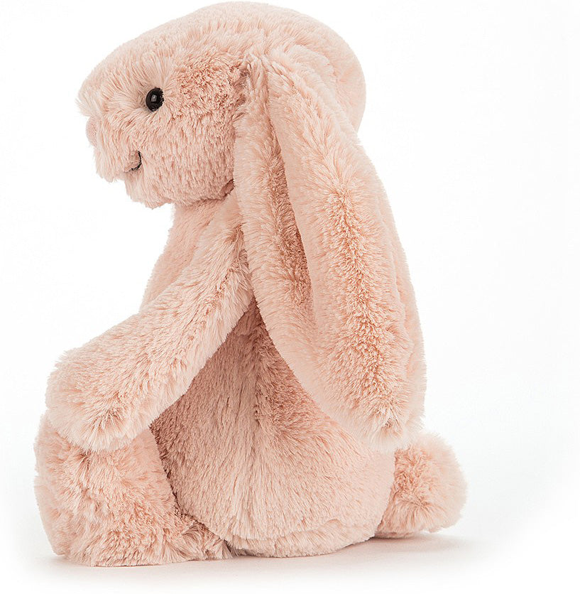 Soft and cuddly Bashful Blush Bunny Medium plush with long floppy ears and a gentle smile, perfect as a comforting toddler toy or gift from Grandrabbit's Toy Shoppe.