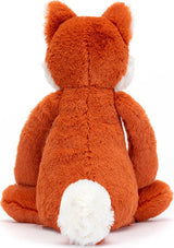 Back view of Bashful Fox Cub Medium plush toy showing soft orange fur, fluffy white tail, and seated posture, perfect as a cuddly stuffed animal for children.