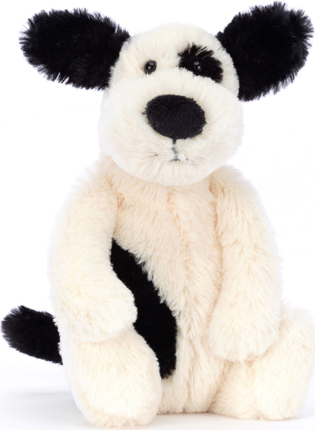 Soft and cuddly Bashful Black & Cream Puppy Small plush toy with black ears, nose, and eye patch, perfect for children as a comforting stuffed animal.