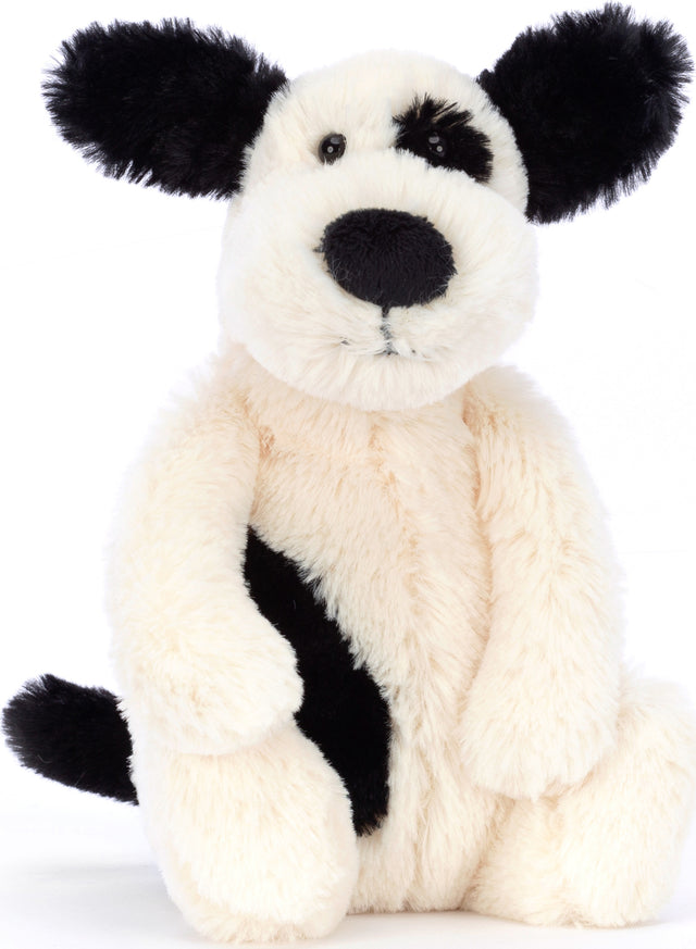 Soft and cuddly Bashful Black & Cream Puppy Small plush toy with black ears, nose, and eye patch, perfect for children as a comforting stuffed animal.