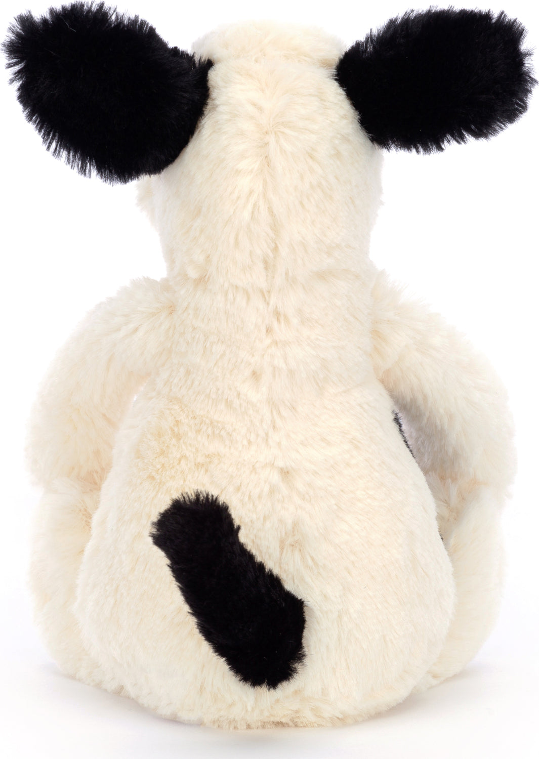 Back view of a soft plush toy Bashful Black & Cream Puppy Small with cream-colored fur, black ears, and a black tail sitting upright.