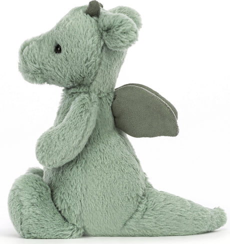 Soft green plush toy in the shape of a small dragon with wings and black eyes, designed as the Bashful Dragon Small, perfect for cuddling and imaginative play.