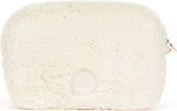 An off-white faux fur Rufferty Puppy Pouchwith a circular embossed logo patch on the front and a silver zipper pull on the right side, shown against a plain white background.