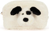 A fluffy faux-fur Rufferty Puppy Pouch shaped like a dog head, with black ears, black eyes, and a black nose on an off-white background.