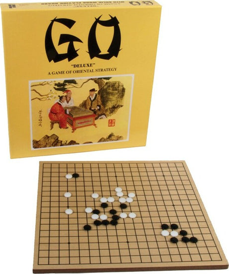 Go game set with board and pieces next to its packaging box.