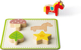 Set of wooden shapes including a mushroom, horse, star, and leaf on a white background from the Memory Touch Recognition Game