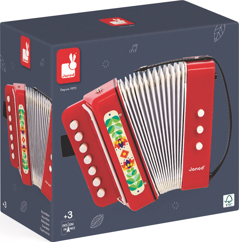 Red Musical Forest Accordion with colorful buttons on a dark grey packaging box featuring Janod branding.