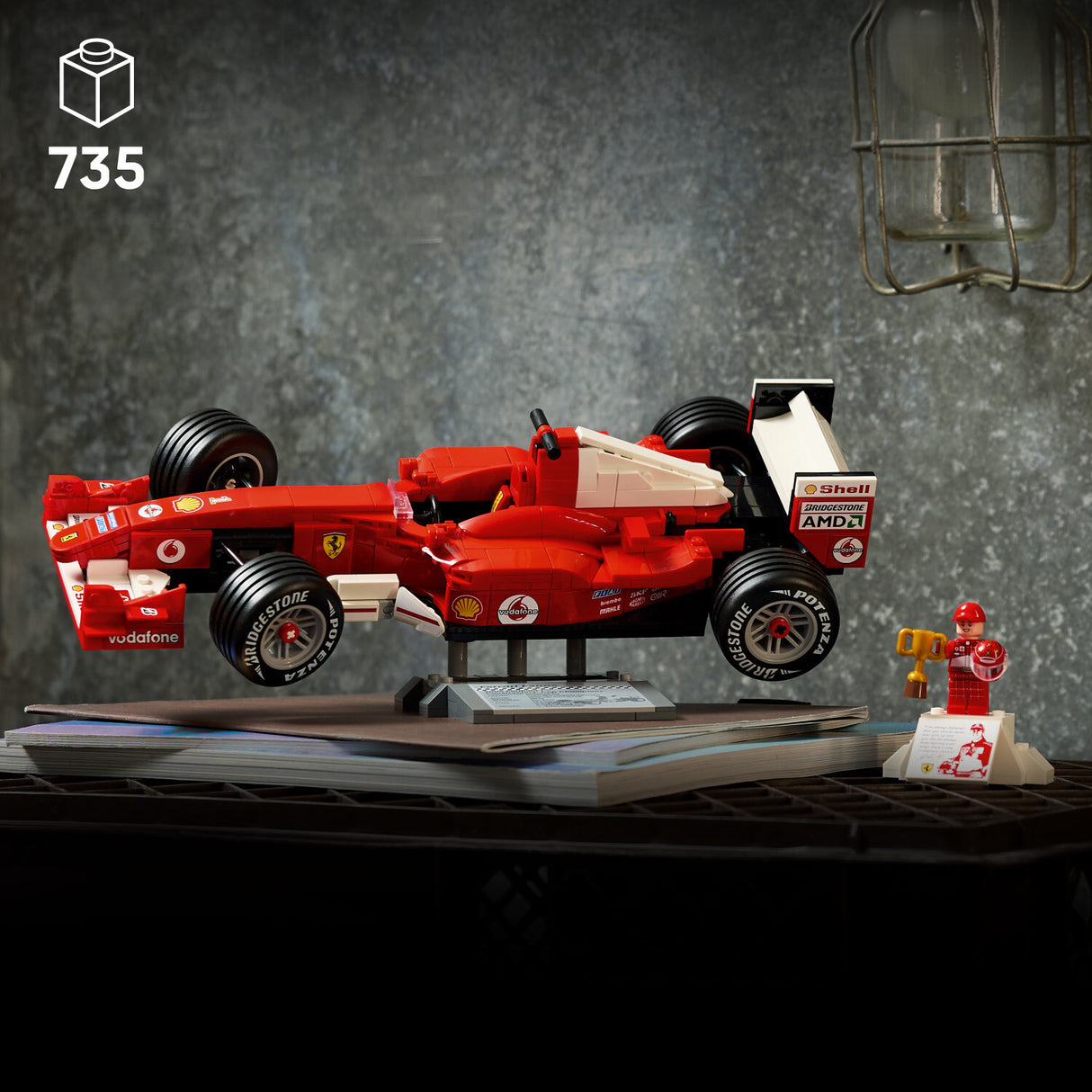 Red LEGO Icons: Ferrari F2004 & Michael Schumacher model with a small figure on a dark surface