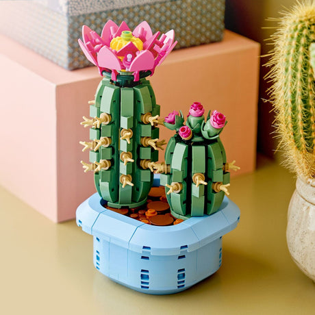 LEGO cactus with pink flowers on a yellow surface