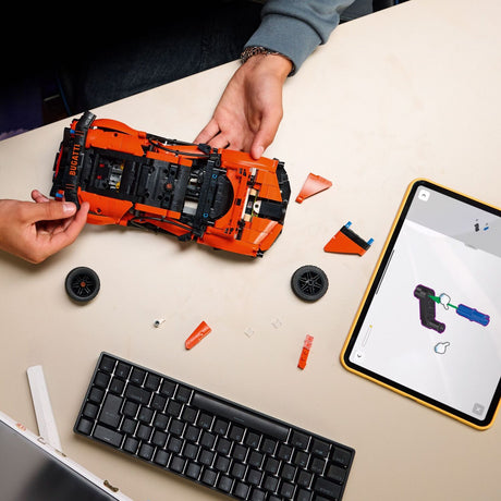 Person building a LEGO Technic: Bugatti Chiron Pur Sport Hypercar