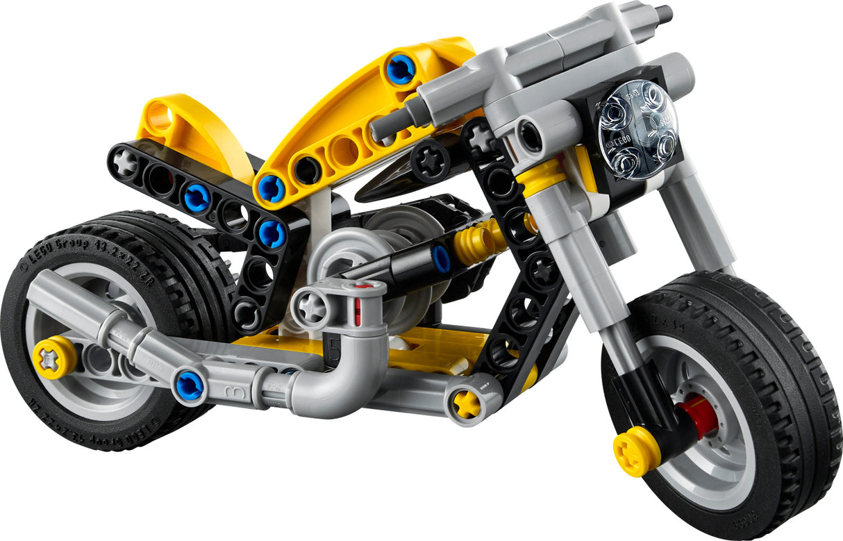LEGO Technic: Yellow Motorcycle toy motorcycle made of interlocking bricks on a white background