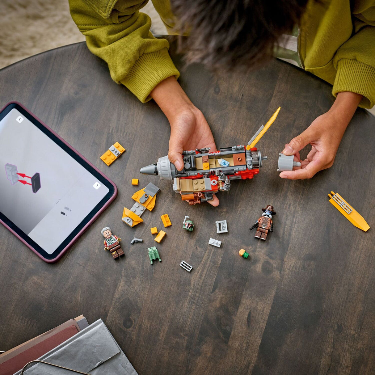 Child building a LEGO Star Wars: Cobb Vanth's Speeder