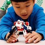 Child holding a LEGO Star Wars: Clone Shock Trooper™ Mech