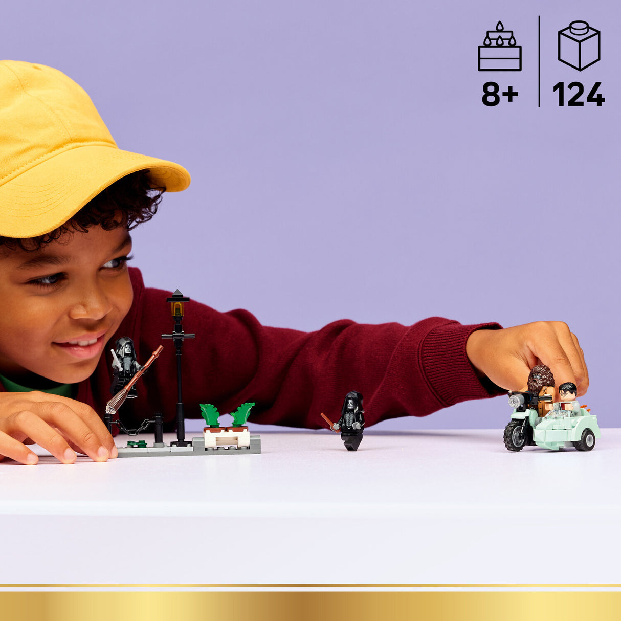 Child playing with a LEGO Harry Potter: Hagrid™ & Harry's Privet Drive Escape